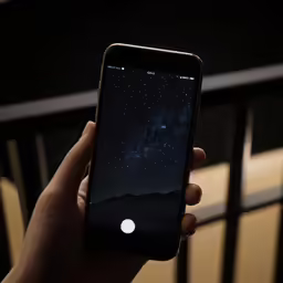 someone holding their phone in their hand with the screen open