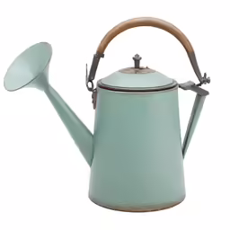 a tea kettle with wooden handle and an empty spoon