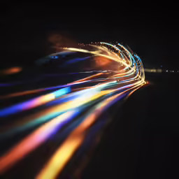 a night time shot shows an intricately colorful light - streaks