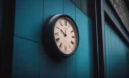 a clock is hanging on the side of a building