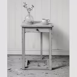 there is a cup on the table and two vases