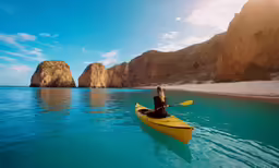 a person is kayaking with two large rocks