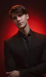 man in suit looking at camera with arms crossed