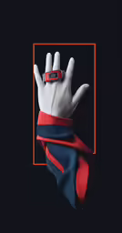 a gloved hand that has a ring on top of it