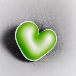 a green heart shape on top of a gray surface