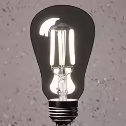 a light bulb on top of a black table