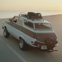 a white van with luggage on top of it driving down the road