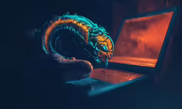 a laptop computer is open and glowing in the dark