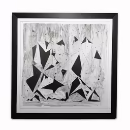 a black and white painting is shown hanging in a frame