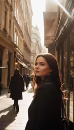a woman standing outside in an alleyway in the city