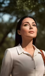 the woman in the white shirt is looking upward