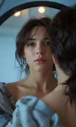 a woman looking in the mirror and covering her face