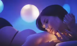 the woman is laying on the bed with her head on her hands