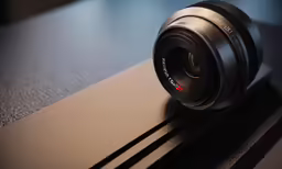 a camera sitting on top of a wooden table