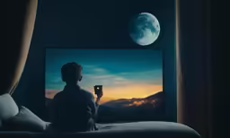 the person is watching the video on tv