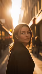 a beautiful young lady standing on a sidewalk in a city