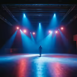 a person standing in the middle of some bright blue lights