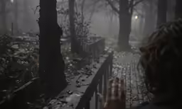 the young child is standing on a small bridge