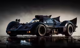 a black race car sits on the pavement