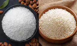 a picture of rice in a wooden bowl next to almonds