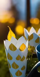 small bowls with paper like designs and a bowl filled with leaf