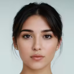 a woman looking at the camera with brown eyes
