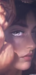 there is a closeup of a young girl with her eyes