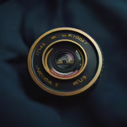 a picture of a camera lens on a blue surface