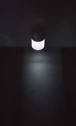 there is a lamp hanging in the dark