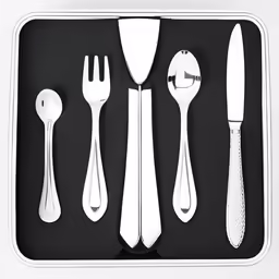 white utensils are in a tray with spoons and forkes