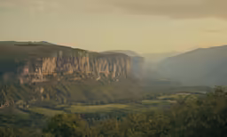 the mountain valley and valley is clear and has many trees