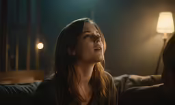 a woman looking away from a man