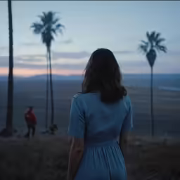 the back view of a person standing in the field