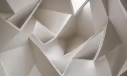 the interior wall is all white and has lots of different boxes in it