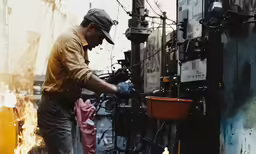 a man working on an industrial machine