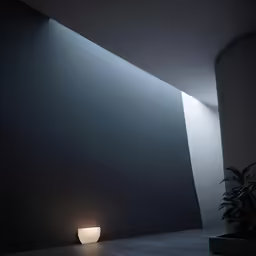 an empty black room is lit by a light