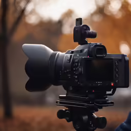 a canon eos2 camera mounted to a tripod