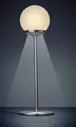 a lamp with its arm around a table top