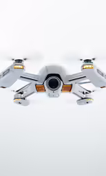 a model of a quad - camera flies in the air