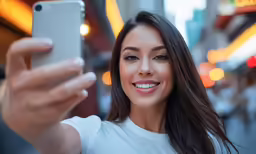 a close up of a person taking a picture with an iphone