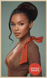 an african woman in orange shirt with ponytails
