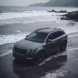 an suv is parked on the edge of some water