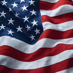 a closeup of a american flag in various shades of red, white, and blue
