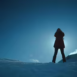 a woman that is standing in the snow