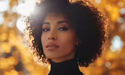 a close up of a person wearing an earring