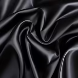 a black and silver cloth with smooth fabric