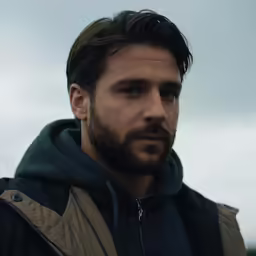there is a man wearing a jacket in a photo
