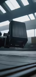 a video camera mounted on top of an escalator