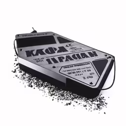 a black and white photo of a broken tray of random black powder