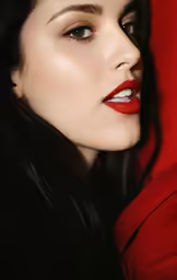 a woman posing with her face to the side with red lipstick